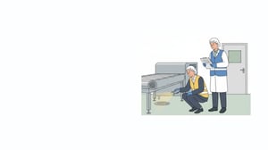 Illustration of a BRCGS auditor shining a flashlight under a conveyor while a QA manager takes notes on a food plant floor